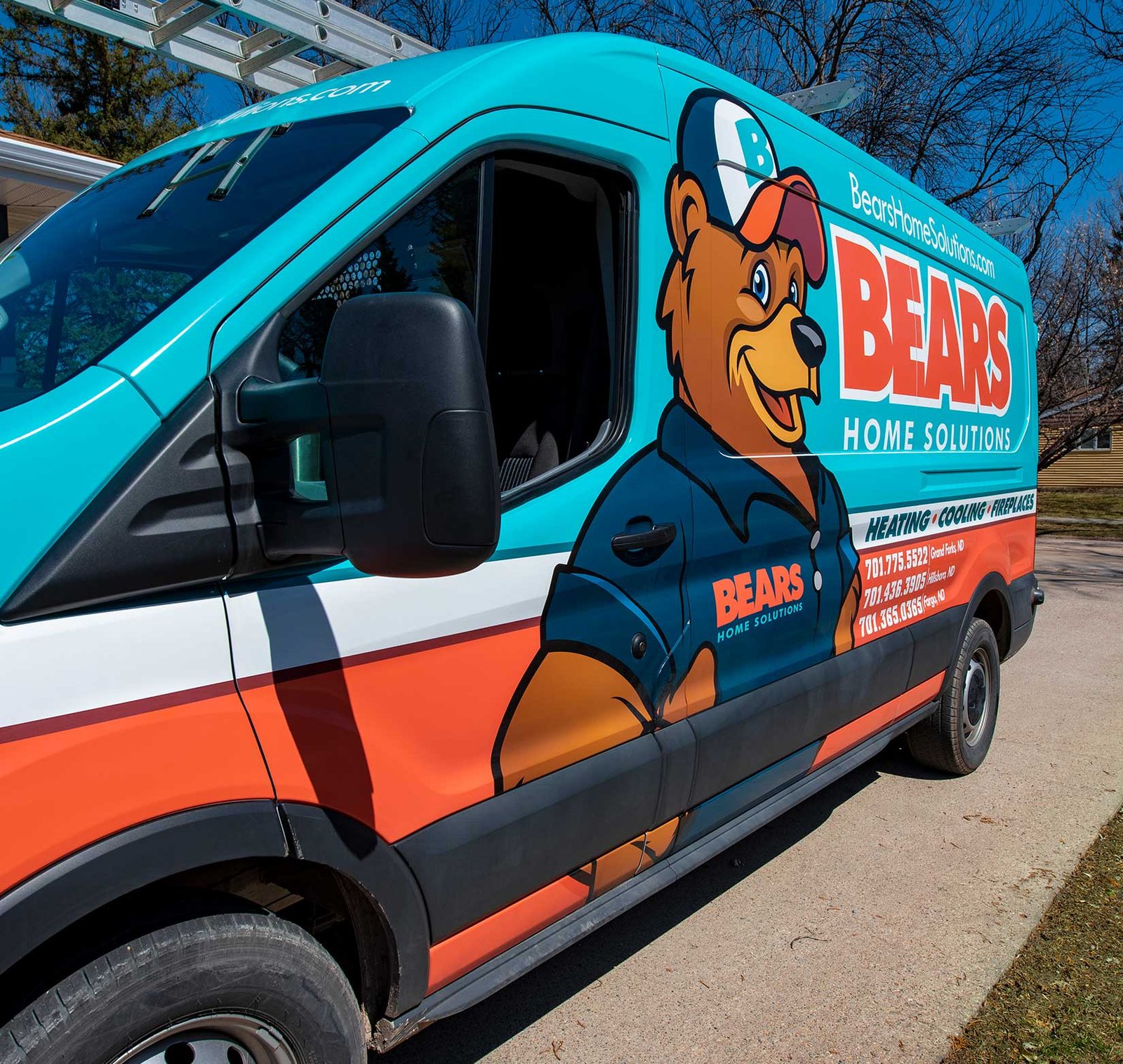 Service fan with a full vehicle wrap to match their brand. It has a company logo with more information about their services.